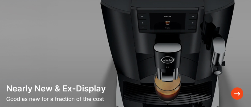 Overhead view of a sleek black coffee machine with a digital display, making an espresso. Text reads "Nearly New & Ex-Display. Good as new for a fraction of the cost."