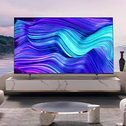 A modern living room features a large TV on a marble stand displaying vibrant blue and purple abstract waves. A peaceful landscape is visible through the window.