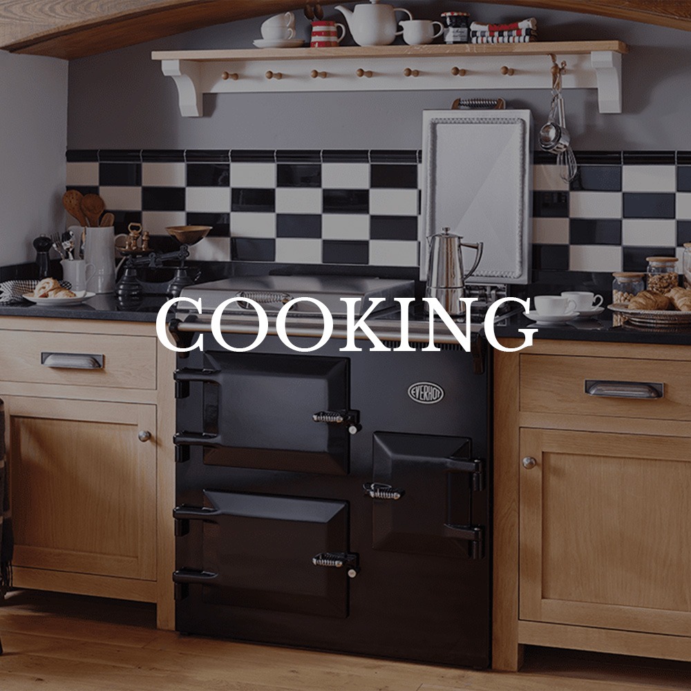 Cosy kitchen scene with a black vintage stove, wooden cabinets, and checkered backsplash. Text overlay reads: Cooking