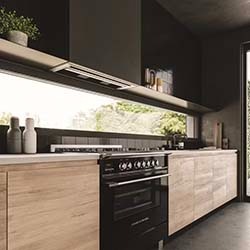 Modern kitchen with sleek, black appliances and wooden cabinets. Large window provides natural light, and minimalistic decor creates a stylish, clean look.
