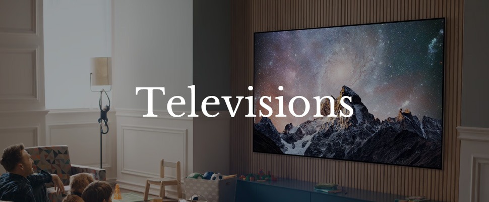 A family watches a TV displaying snowy mountains under a starry sky. The word "Televisions" overlays the image, suggesting a cosy and modern living room ambiance.